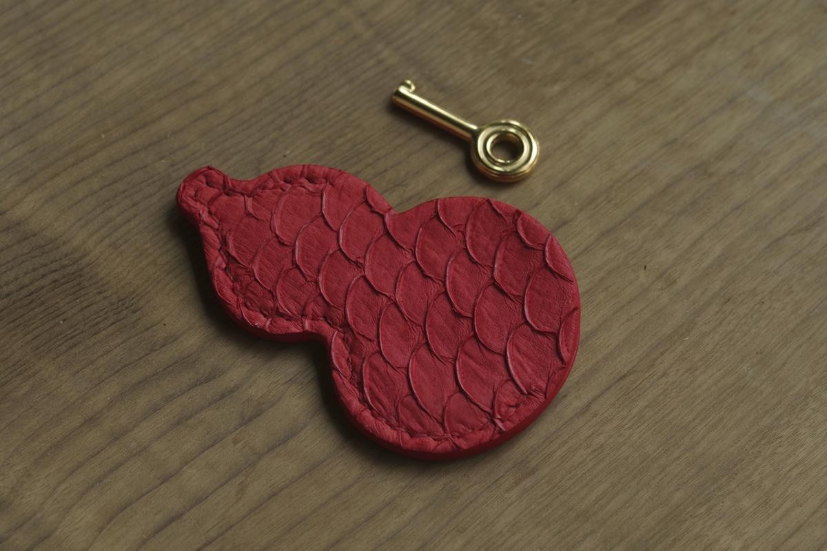Pair of red carp-leather key covers